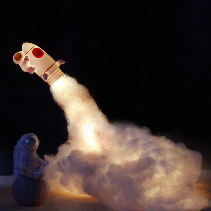 DIY astronaut rocket night light kit components including rocket model, chassis, straws, and LED string lights