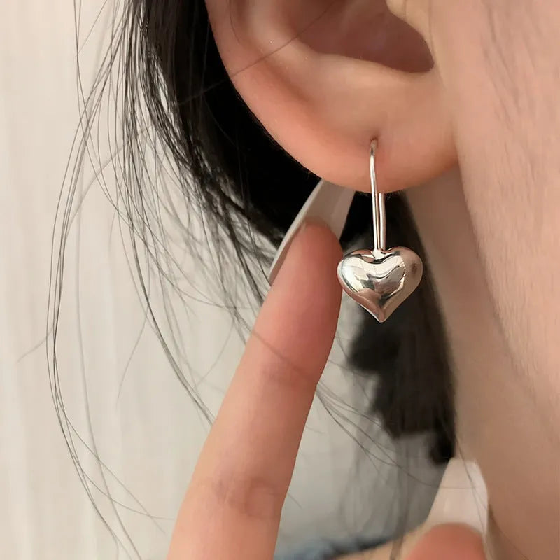 Three-dimensional glossy heart earrings with Korean style silver tone finish