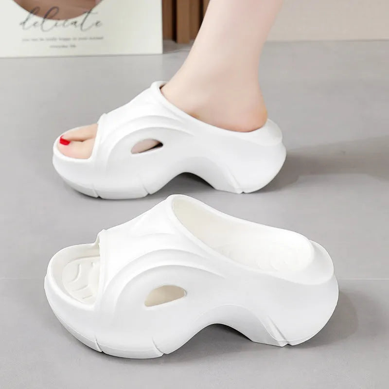 Women's thick-soled EVA slippers in rose red colour with round toe.