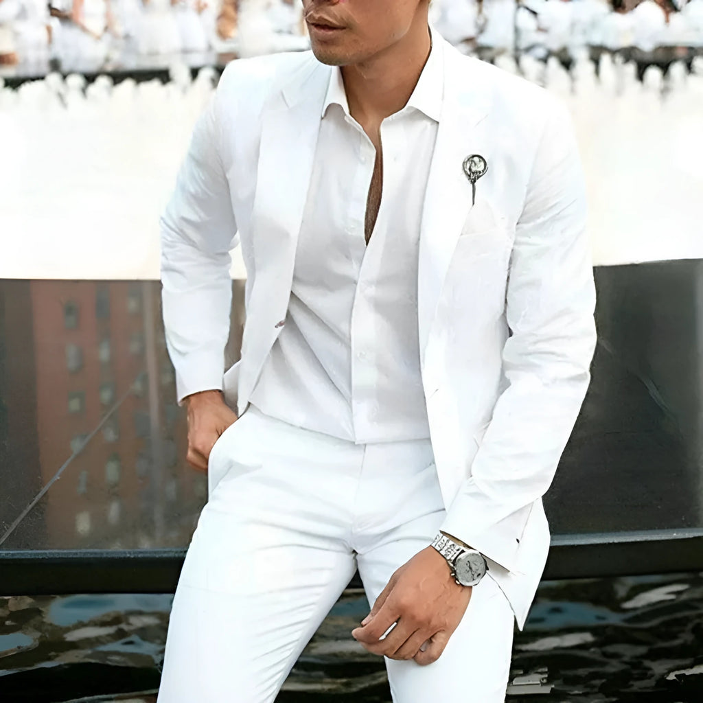 Men's white slim fit two-piece wedding suit jacket and trousers on a hanger.