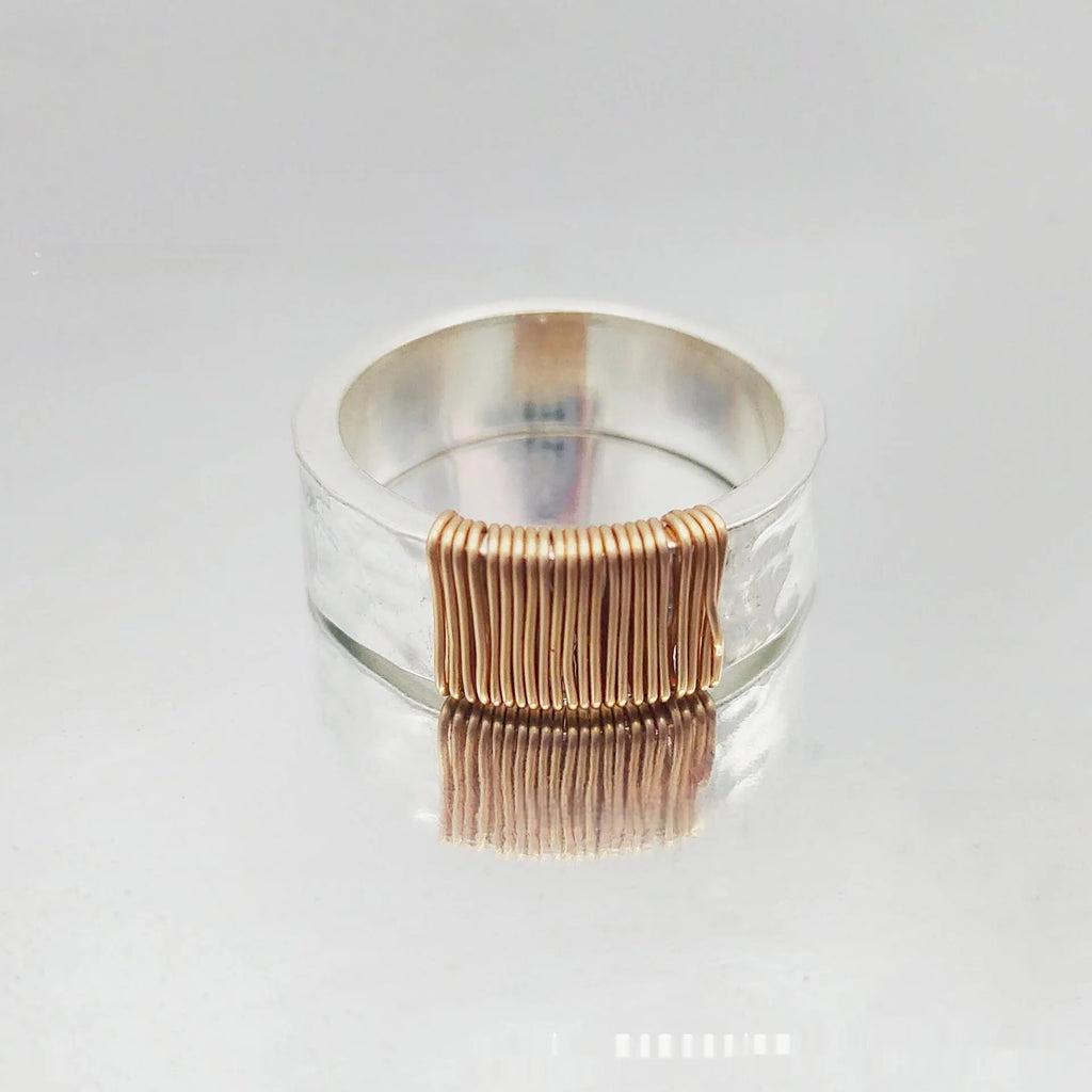 Copper geometric bracelet with irregular coil design in electroplated silver gold colour
