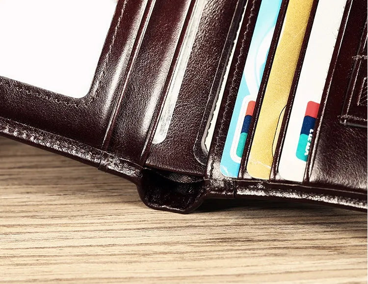 Men's leather wallet showing multiple internal compartments including card slots and change purse