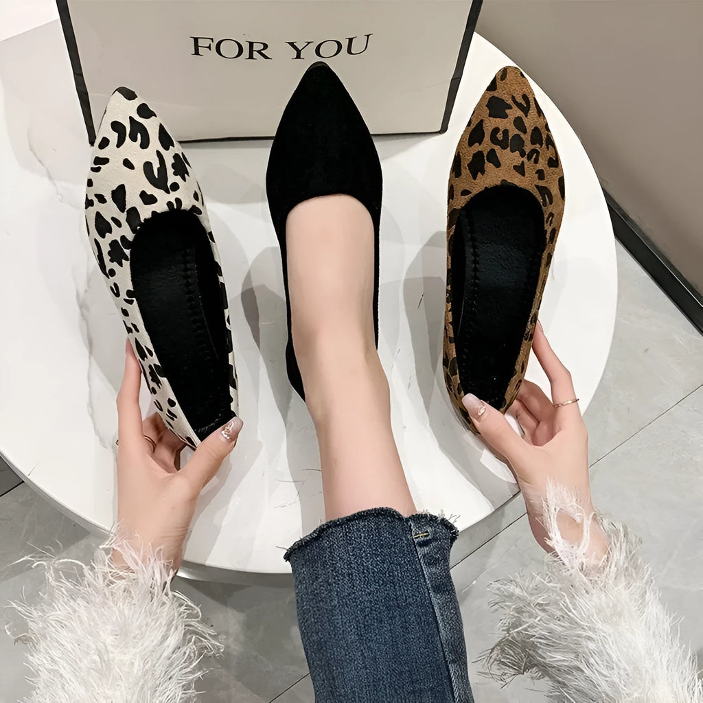 Women's flat pointed toe pumps with leopard print, cotton cloth upper, and low flat heel