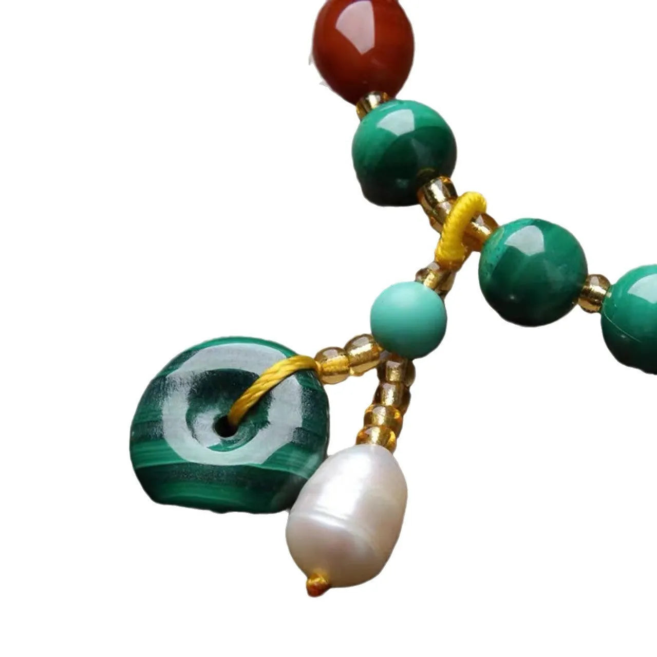 Natural malachite bracelet with green banded barrel beads on a neutral background