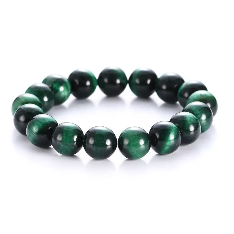 Green tiger eye stone bracelet with polished geometric beads in natural stone material