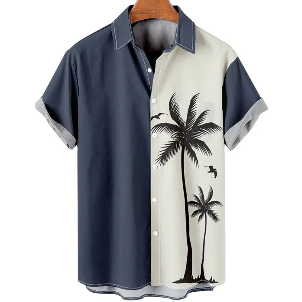 Man wearing a slim fit short sleeve shirt with a colourful 3D floral print, on a beach.