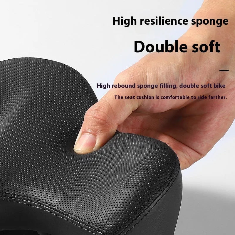 Black bicycle seat cushion with leather exterior and foam padding for shock absorption
