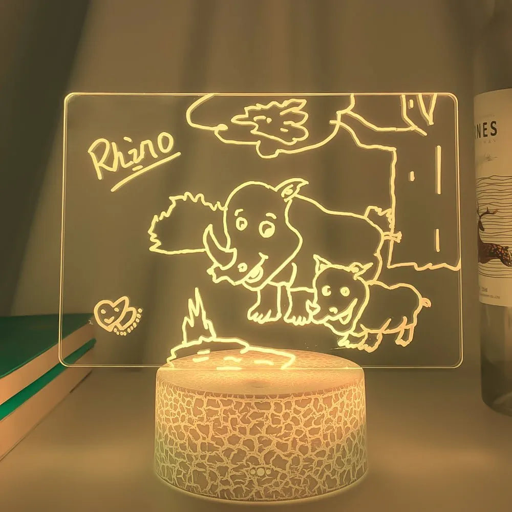 3D acrylic message board night light with handwritten note, showing colour-changing illumination and remote control.