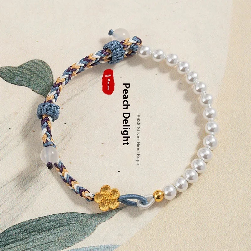 Colorful electroplated cord carrying strap with pearls and flowers and a sterling silver chalcedony charm