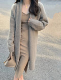 Women's medium length V-neck knitted cardigan in loose free size, shown in khaki colour