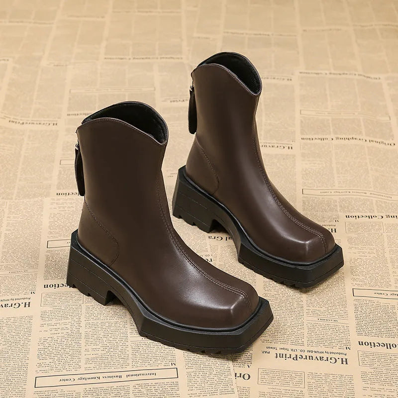 Black square toe platform ankle boots for women with a back zipper and chunky heel.