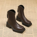Black square toe platform ankle boots for women with a back zipper and chunky heel.