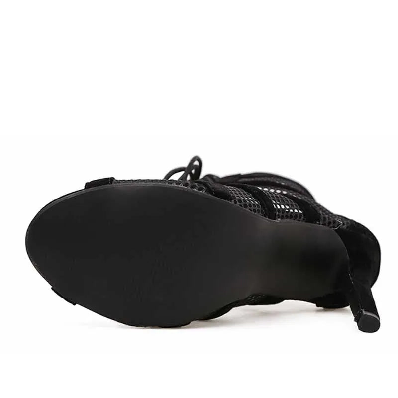 Black suede women's lace-up high heel shoes with 11.5 cm heels shown from side view