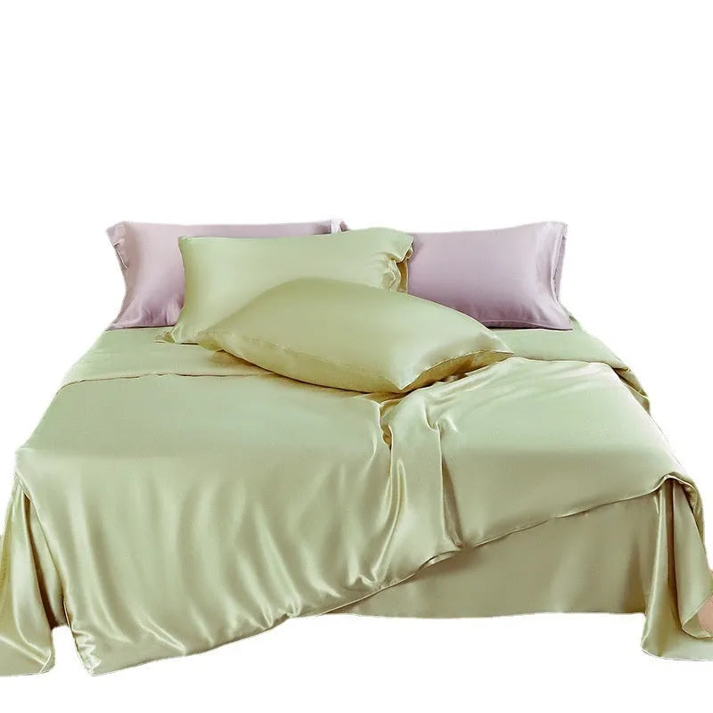 Silk double-sided duvet cover showing reversible design in solid colours including lotus pink, pea green, and bright brown