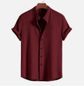A loose-fitting men's short sleeve casual shirt in a light blue colour, laid flat.