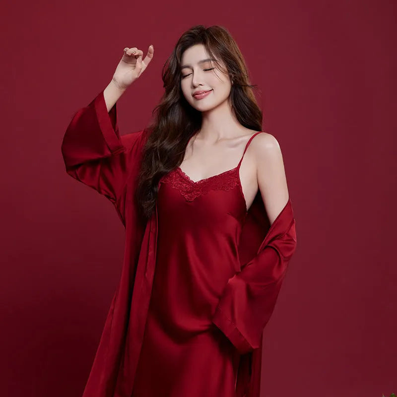 Red silk pyjama set for couples with long sleeves and trousers, shown in men's and women's matching styles