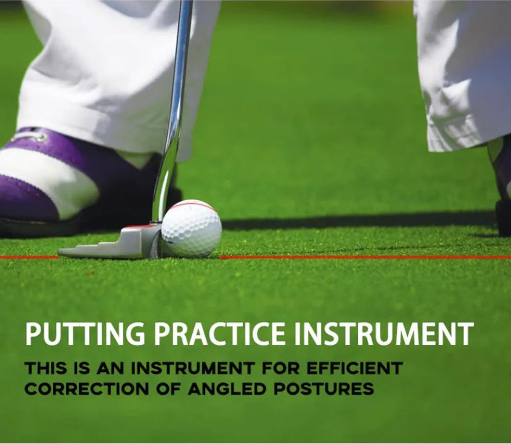 Black golf laser aiming instrument attached to a putter on a practice green