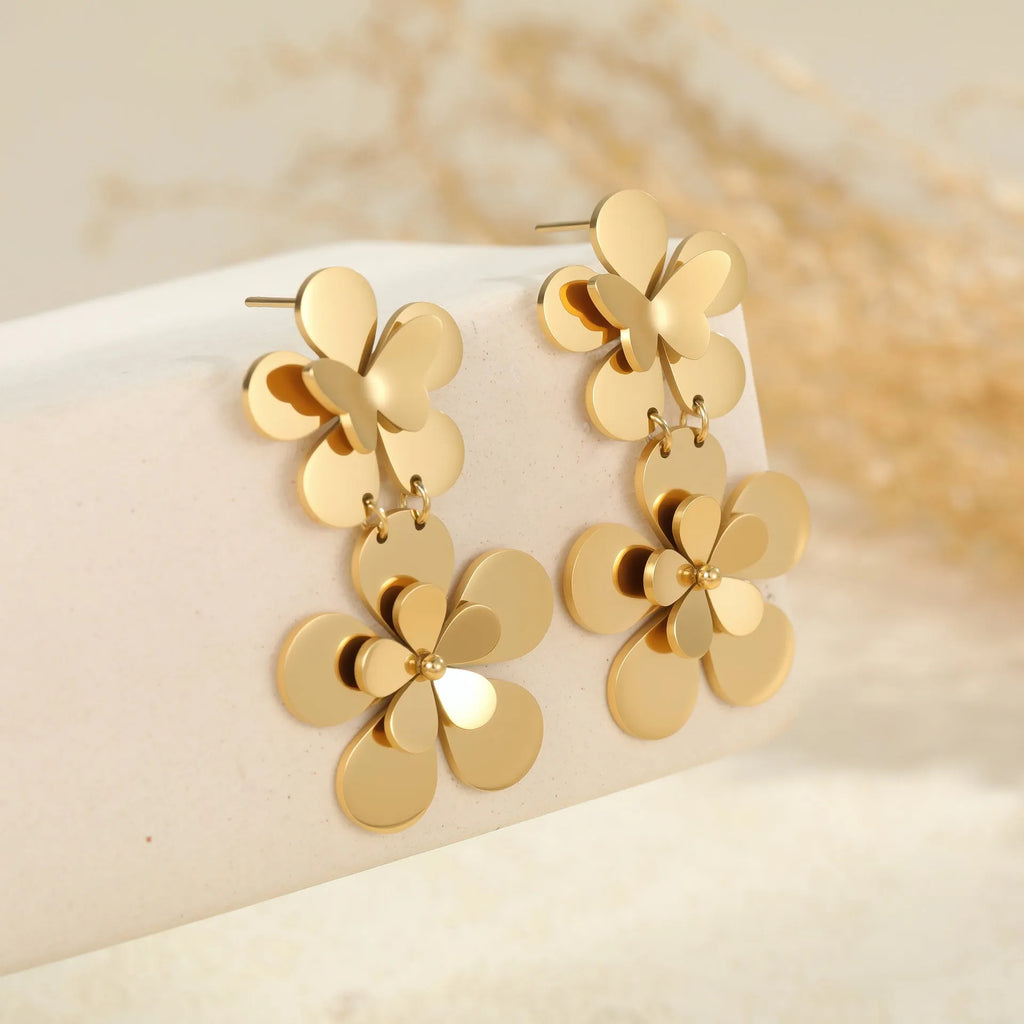 Women's stainless steel earrings with 18K gold electroplated flower butterfly design and post backs