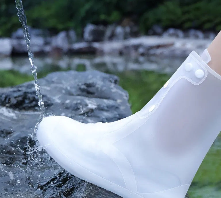 White high-top PVC reusable shoe covers for women, shown with size chart.