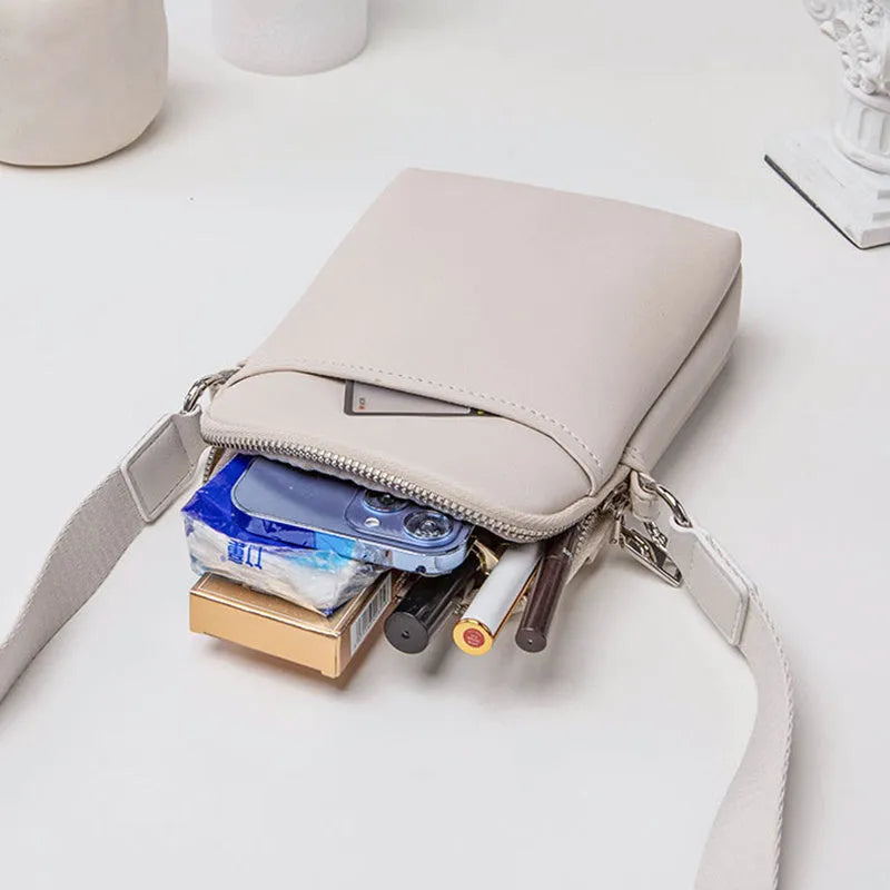 Solid colour PU leather mobile phone shoulder bag showing crossbody and shoulder carry options