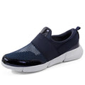 Women's blue breathable sneakers with mesh interior and low-top design on indoor surface