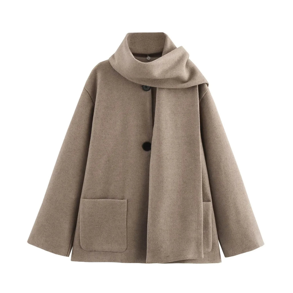Women's long camel coat with a detachable artificial fur collar in a street fashion style.
