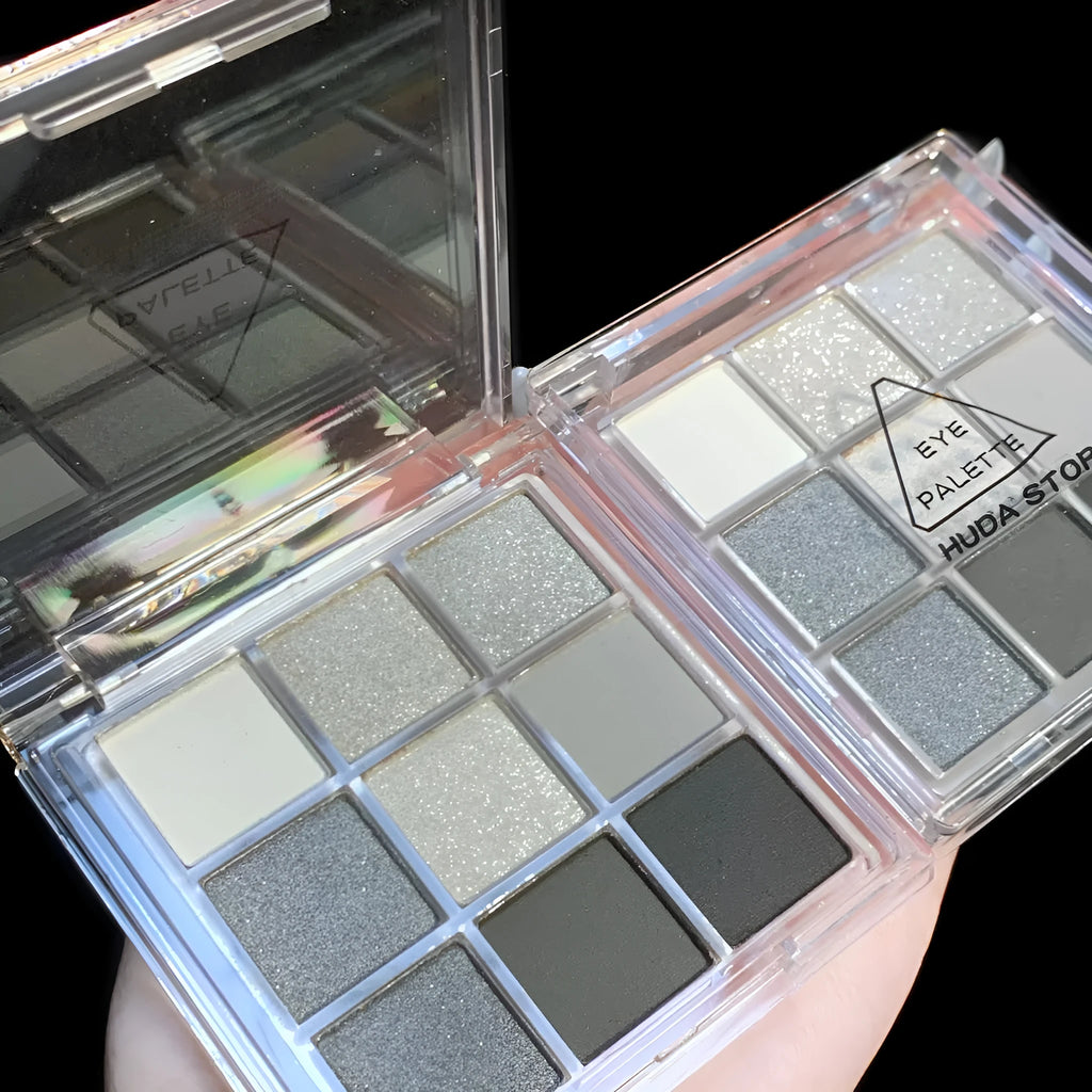 Smoked nine-colour eyeshadow palette showing shades including white, silver, black, and iron grey