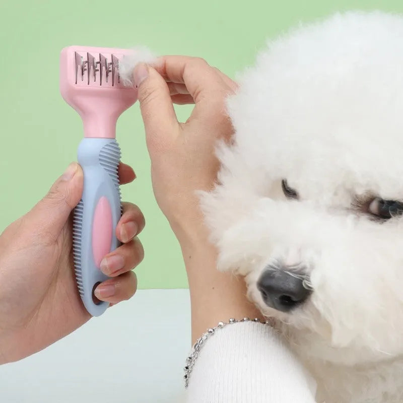 Pink stainless steel pet comb with integrated knot knife for grooming dogs and cats.