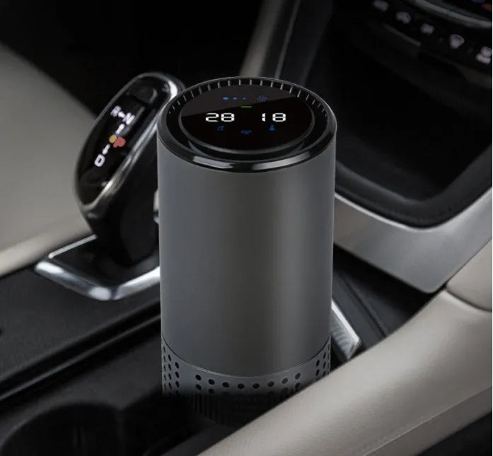 Car air purifier with water cup design and aluminium alloy housing showing air quality display