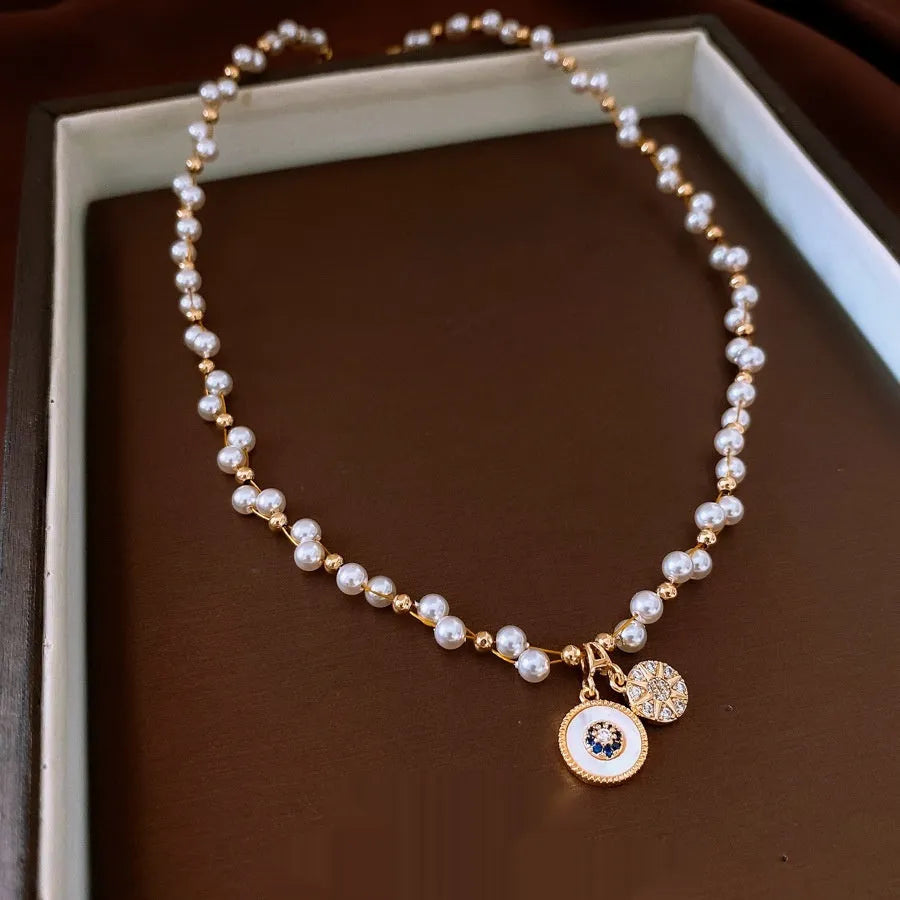 Gold electroplated zircon pearl round pendant necklace with adjustable clavicle chain