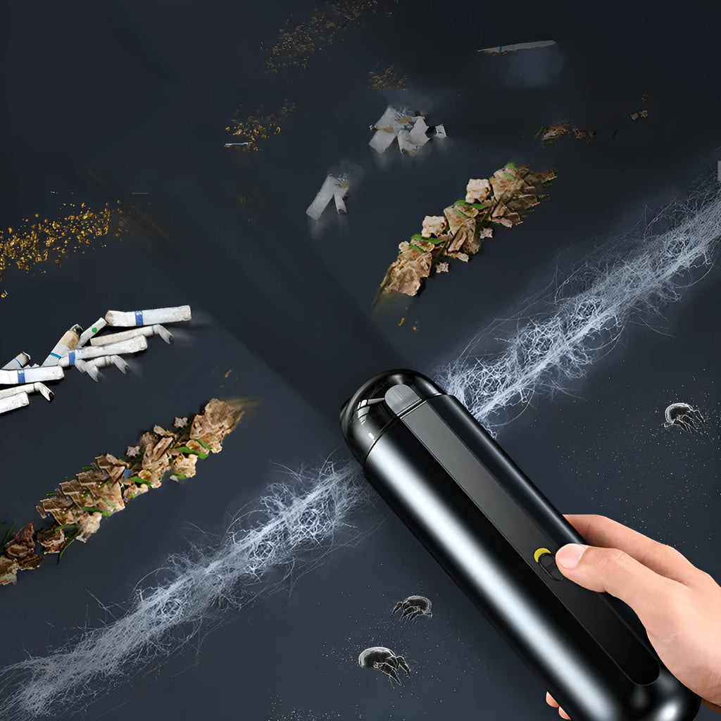 BASEUS wireless handheld car vacuum cleaner in black on a car seat, showing compact size and nozzle attachment.