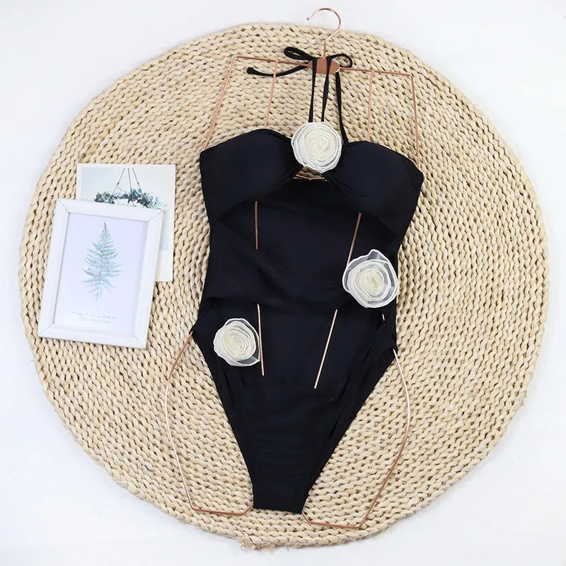Women's black one-piece swimsuit with 3D flower design, nylon fabric, front view