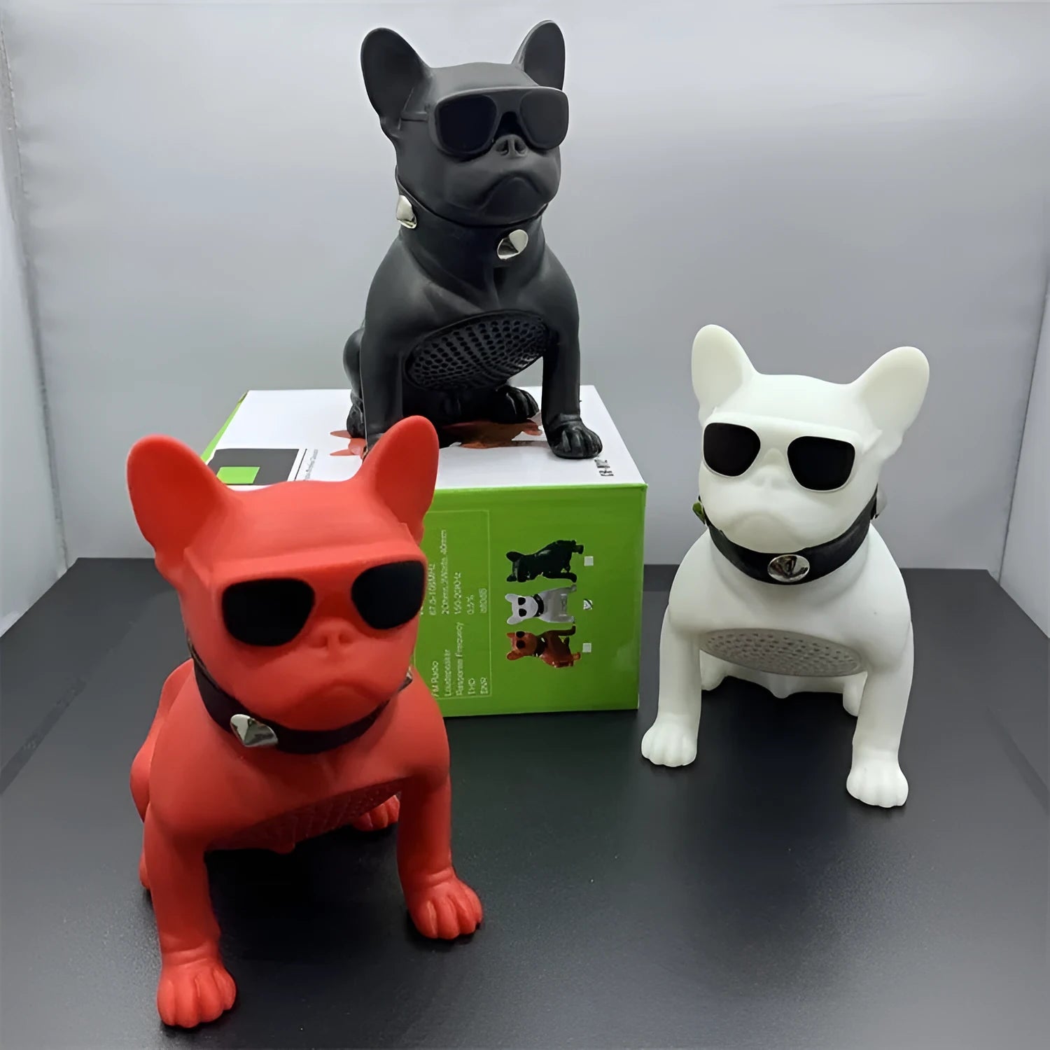 Mini bulldog-shaped Bluetooth speaker in black, red, or white colour with wireless audio connectivity