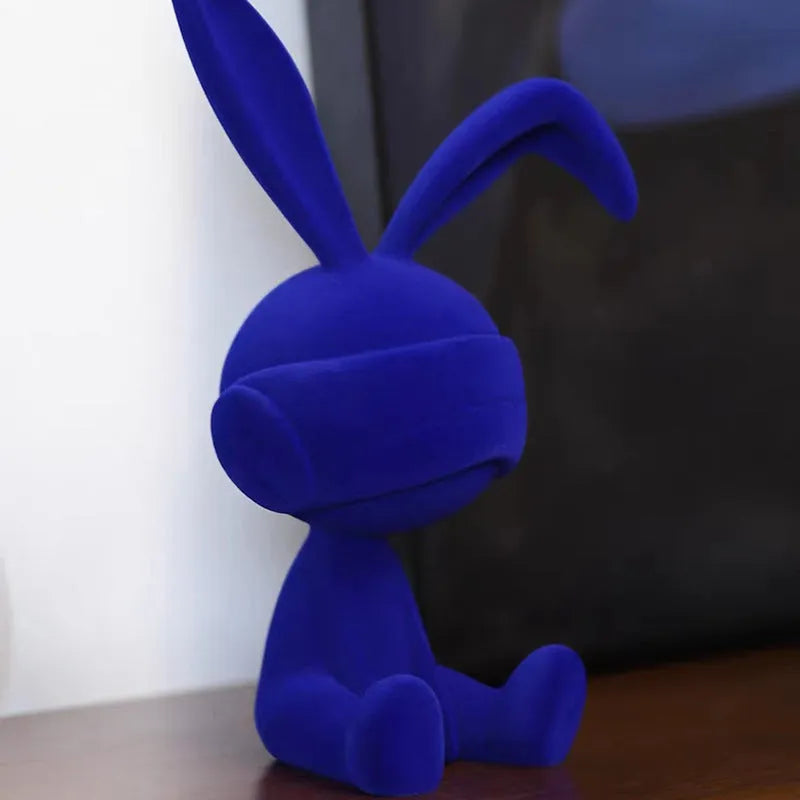 Resin rabbit ornament with suede blindfold in blue, green, or red colour options