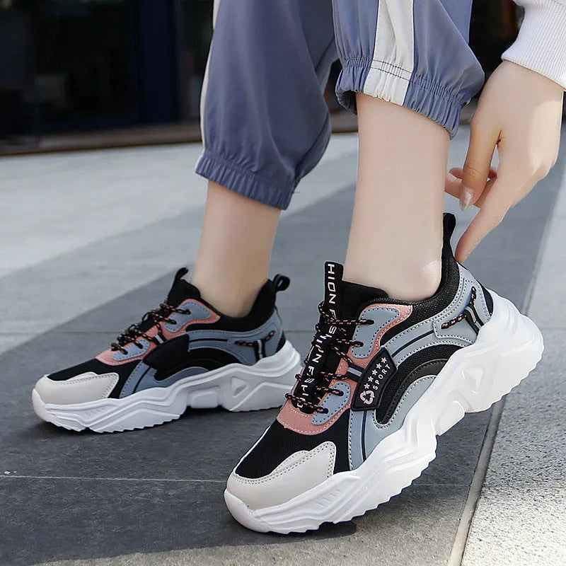 White women's thick-soled casual sports shoes with mesh upper and buckle detail