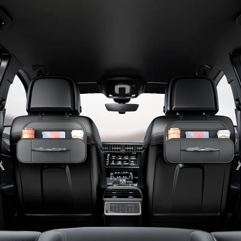 Black leather car seat rear storage bag showing its box shape and size against a vehicle seat.