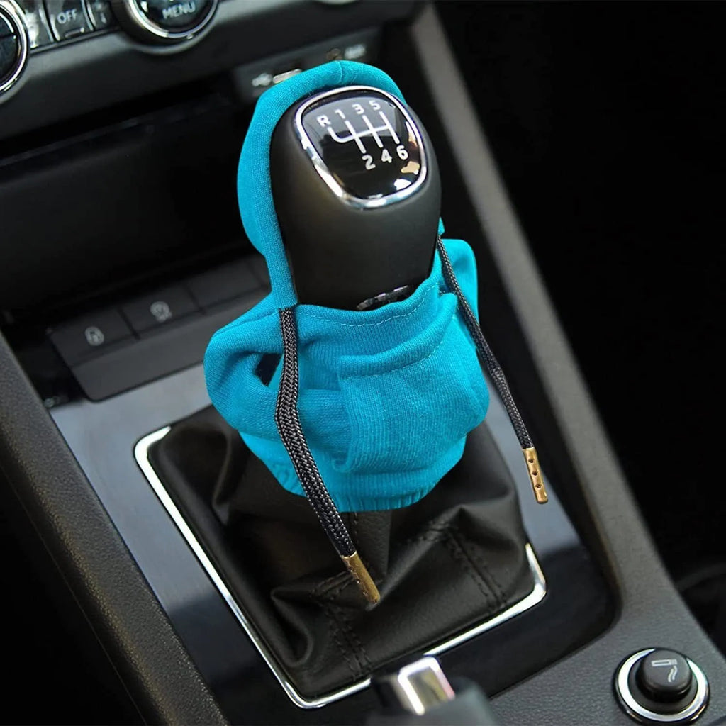 Blue cloth gear shift knob cover with sewn edges, shown next to a 13cm by 8cm size guide.