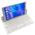 Mini folding ultra-thin wireless Bluetooth keyboard in black, open and ready for typing with a tablet