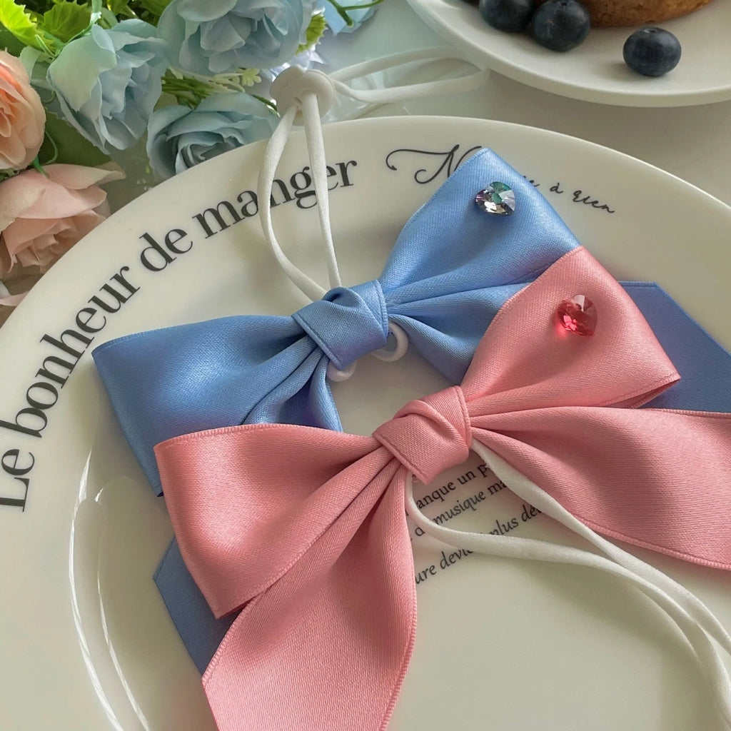 Adjustable princess style dog hair band with bow tension on small dog