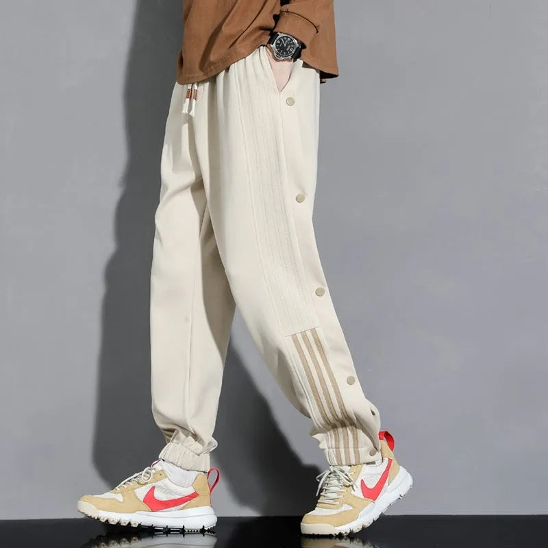 Men's loose cotton blend sweatpants with ankle-tied cuffs in black colour