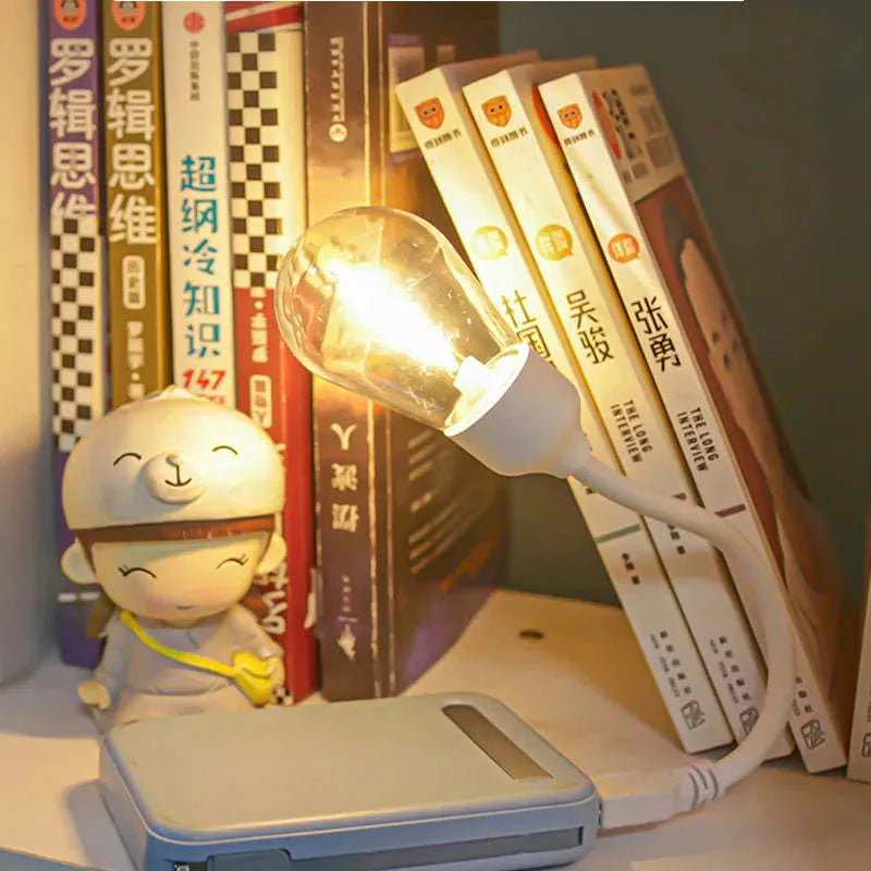 USB rechargeable folding night light with tungsten filament LED bulb in open position