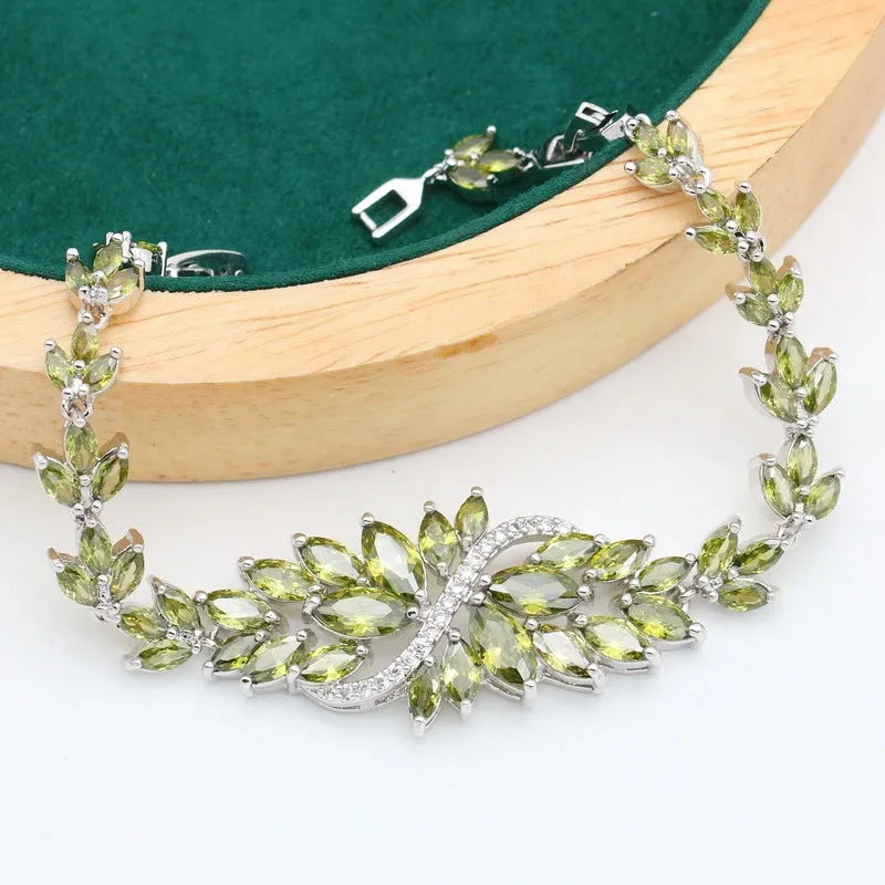 Retro copper jewellery set with zircon stones showing necklace, bracelet, earrings and ring with floral patterns