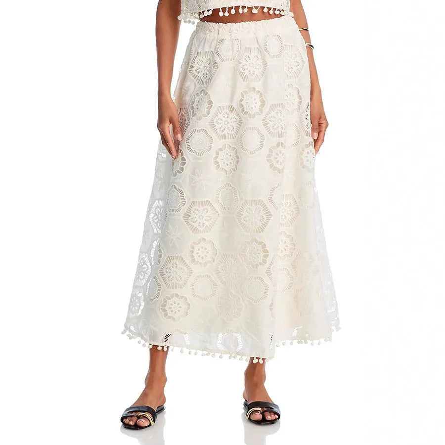 White polyester women's suit set with sleeveless top and long skirt featuring retro embroidery