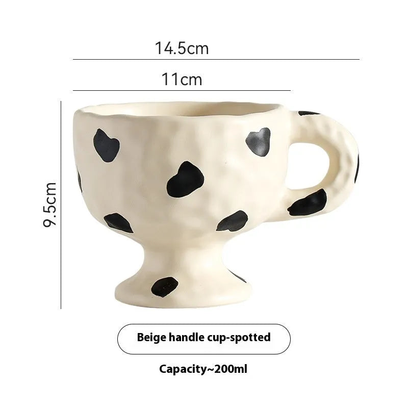 Hand-pinched irregular shaped ceramic mug in solid colour, 250ml capacity