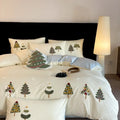 Pure cotton bedding set with embroidered Christmas tree pattern in cream blue or green, showing duvet cover, sheet, and pillowcases.