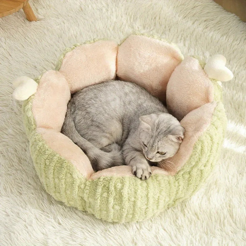 Soft green cactus-shaped cat litter kennel for dogs and cats on a floor.