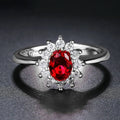 Women's electroplated copper ring with flower-shaped zirconium detail in blue, green, or red.