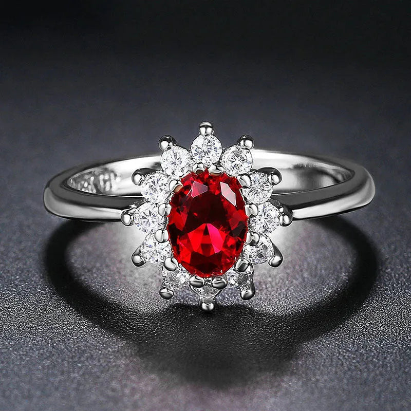 Women's electroplated copper ring with flower-shaped zirconium detail in blue, green, or red.