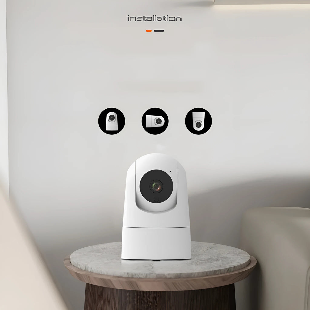 Compact white indoor smart security camera on a stand with a visible lens.