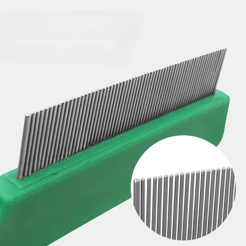 Green plastic handle stainless steel pet flea comb for dogs and cats on white background